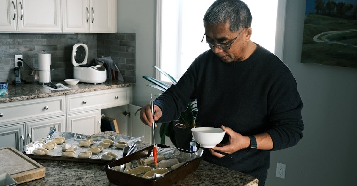 A home health aide preparing a meal, part of in home senior care cost planning