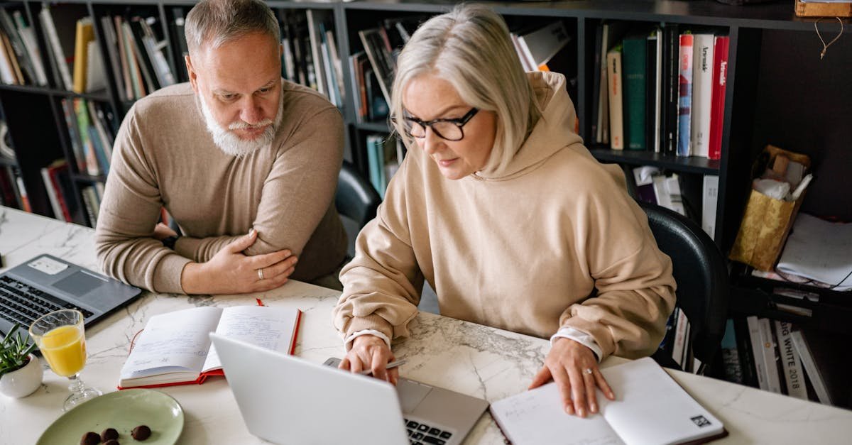 A senior couple comparing Medicare Part D prescription coverage plans at home