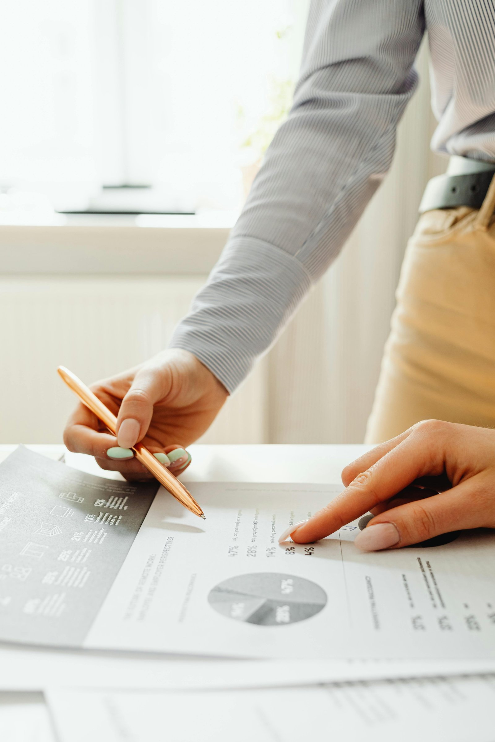 A thoughtful person reviewing financial documents and a calculator while planning ahead