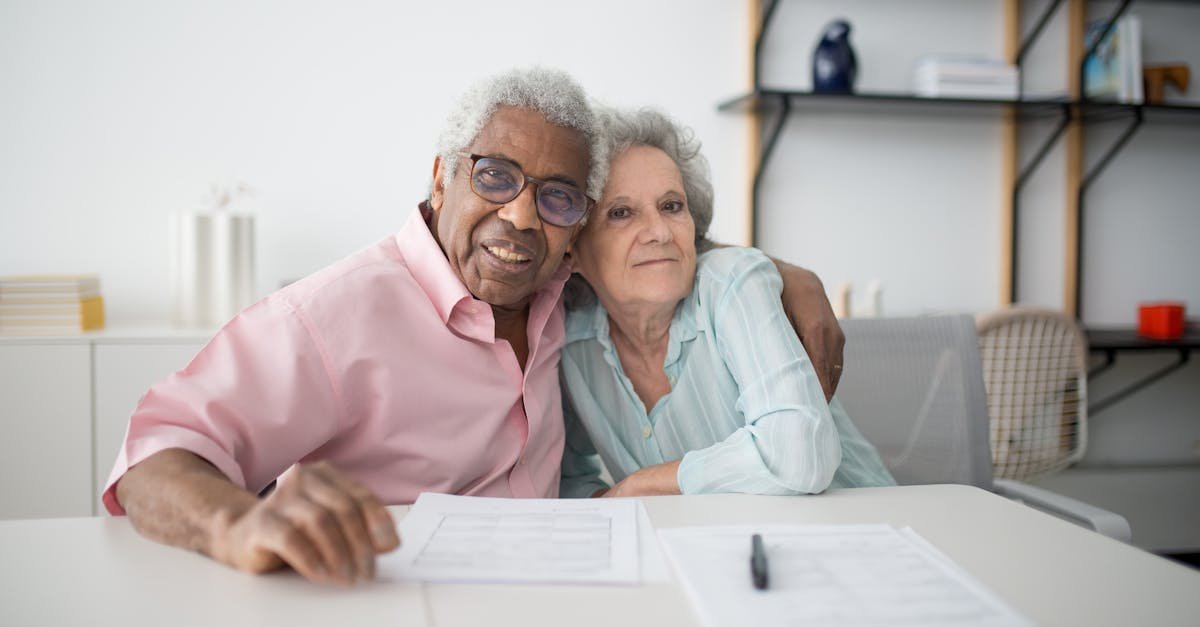An older couple comparing Medicare Advantage vs Medigap options at a kitchen table with paperwork