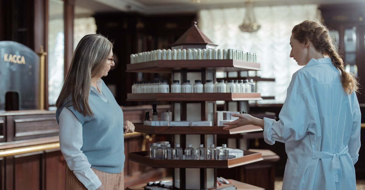 A senior reviewing Medicare Part D prescription coverage options with a pharmacist