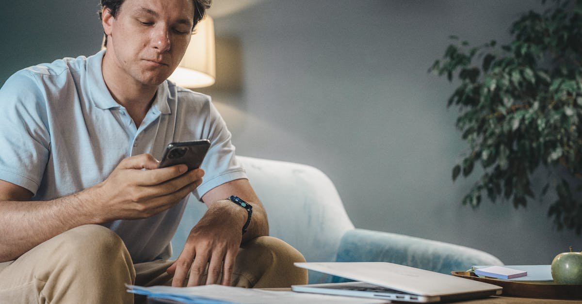 A person on the phone with their insurer while learning how to read an explanation of benefits